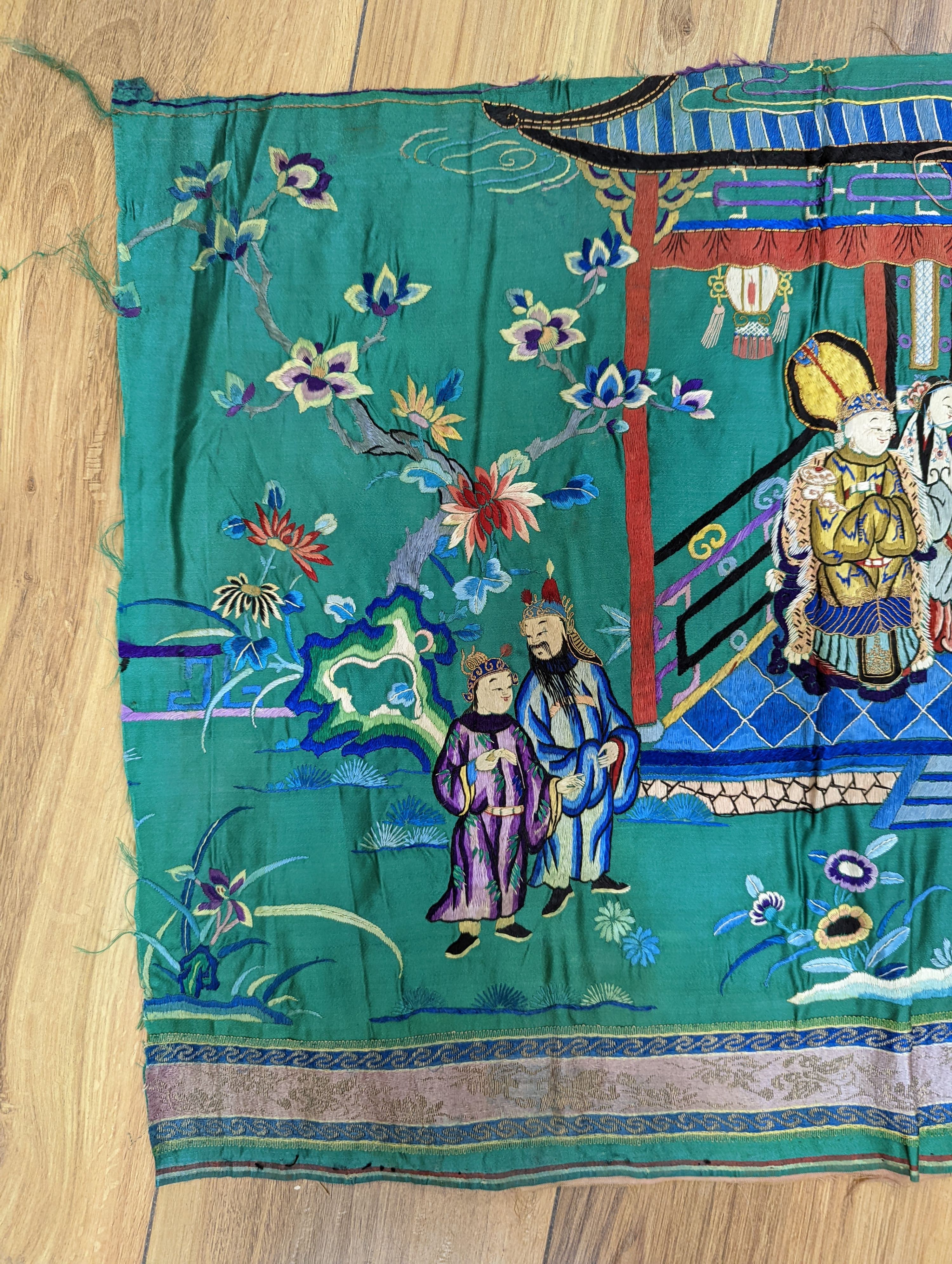 An early 20th century Chinese silk figurative embroidery from a larger panel of an emperor and empress scene.